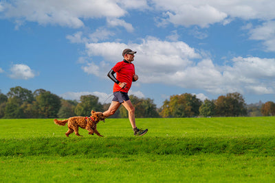 Man running with dog