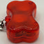 Red reflective safety light on a white background