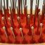 Rows of small metal brush head with white tips