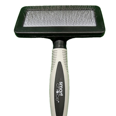 Pet grooming brush with head and handle on a white background