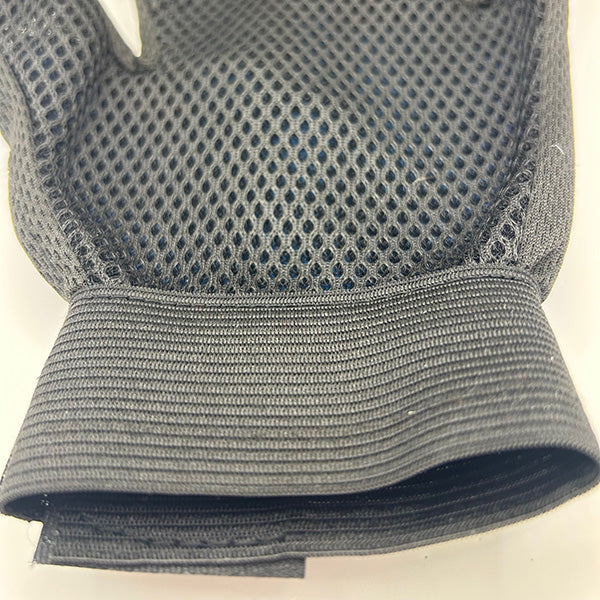 Close-up of a black palm side of glove with mesh design on a white background