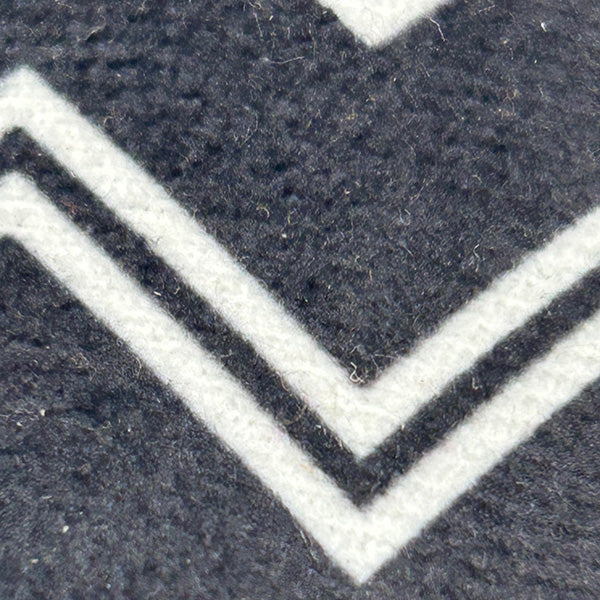 Close-up of a textured surface with a chevron pattern