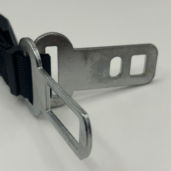 close up of the two seat belt buckles on a white background