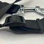 Close-up of a black strap adjustment with a metal clip on a white background