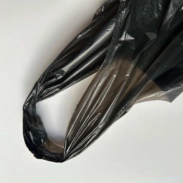 Black doggy bag handle on a white background
