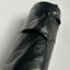Sealed roll of black doggy bags on white background