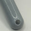 Close-up of a grey scoop handle with a circular hole on a white background