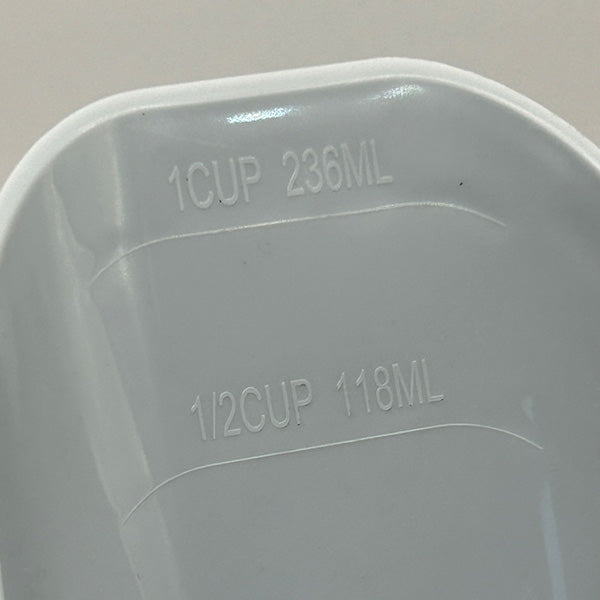 Measurement markings on a plastic scoop with 1 cup and 236ml, and 1/2 cup and 118ml labels.