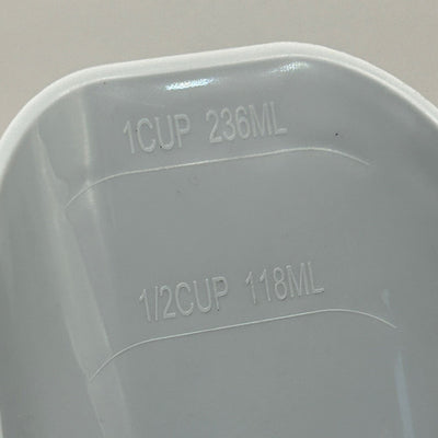Measurement markings on a plastic scoop with 1 cup and 236ml, and 1/2 cup and 118ml labels.