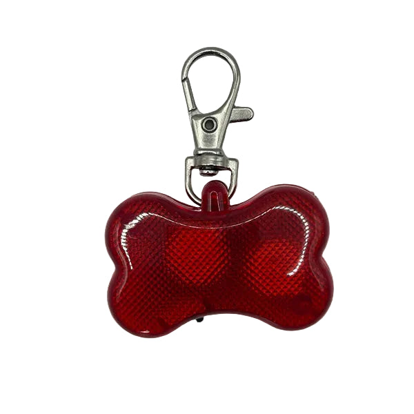 Red bone-shaped keychain light with a metal clip on a white background